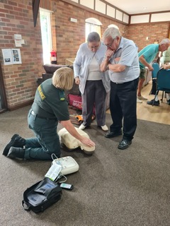 Demonstration of CPR and using a defibrillator