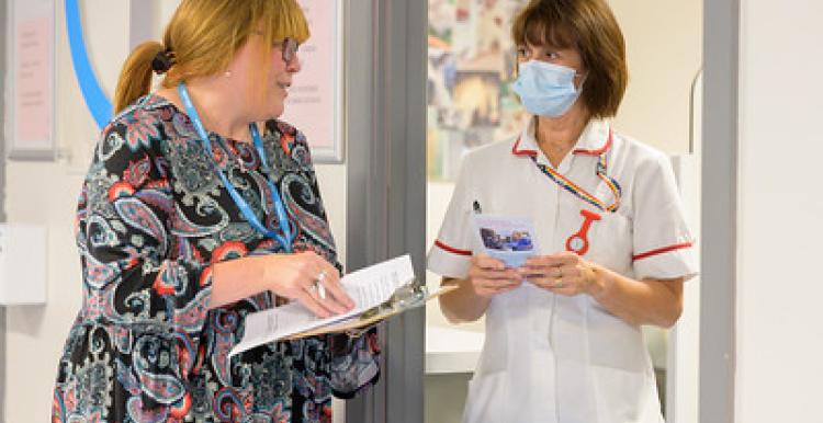 Nurse talking to a healthwatch lady
