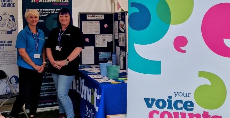 Healthwatch Rotherham staff standing by their stall