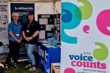 Healthwatch Rotherham staff standing by their stall