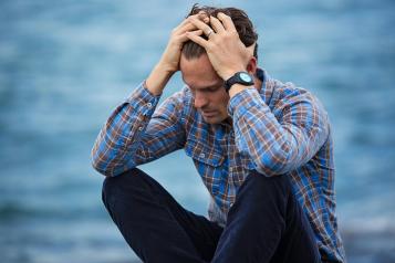 Man sat with his head in his hands