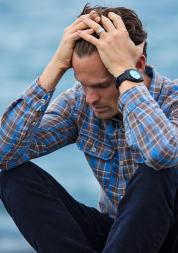 Man sat with his head in his hands